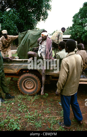 Wounded Sudan Peoples Liberation army soldier who has been shot during a confrontation with  northern Sudanese army troops being taken to a hospital in Southern Sudan during the civil war in 1997 Stock Photo