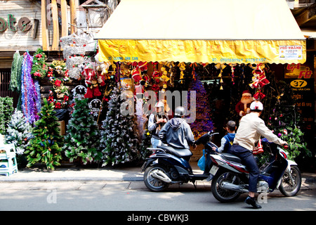 Christmas trees in shop, Old Quarter, Hanoi, Vietnam, Asia Stock Photo