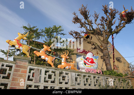 Santa Claus Sleigh, Christmas decorations outside suburban house, UK Stock Photo