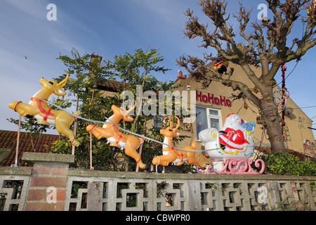 Santa Claus Sleigh, Christmas decorations outside suburban house, UK Stock Photo