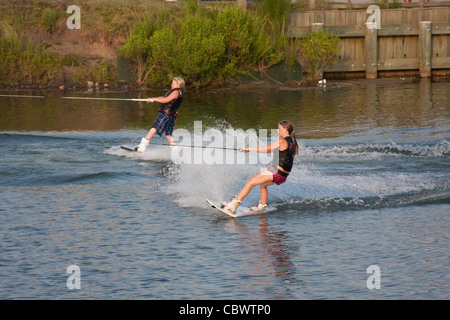 Young Boy And Girl Wake Boarding Stock Photo