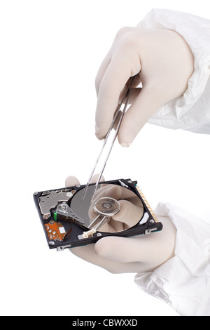 hard drive and tweezers in hand isolated on white background Stock Photo