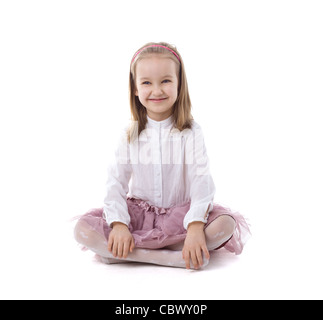 Beautiful young girl sits with her legs crossed Stock Photo