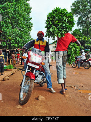 Street scene with cassava and motorbike in Kenema, Sierra Leone