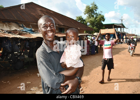Smiling man with his son in Kenema, Sierra Leone