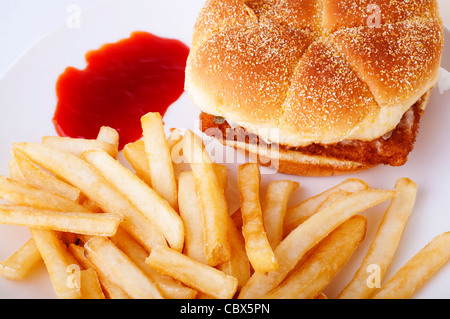 Fish burger and French Fries on plate Stock Photo