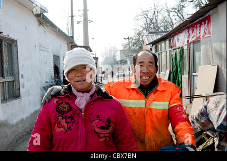 Beijing, Mrs. Li Yanhong and Mr. Wang Longsheng. Mrs. Li and Mr. Wang are a couple. They work as street cleaners in the Lidu are Stock Photo