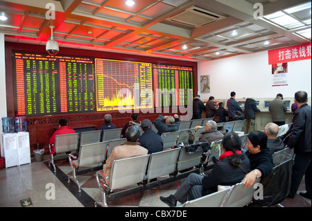 Beijing. CITIC Securities provides clients with dealing rooms for trading shares. Stock Photo