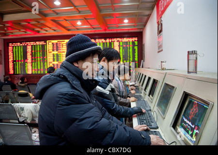 Beijing. CITIC Securities provides clients with dealing rooms for trading shares. Stock Photo