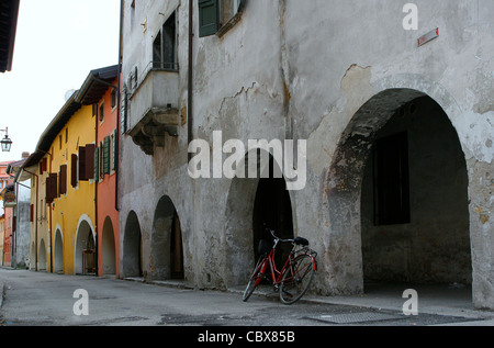 A bicycle leaning on the arcades of the Via Simoni in Spilimbergo, Italy. Stock Photo