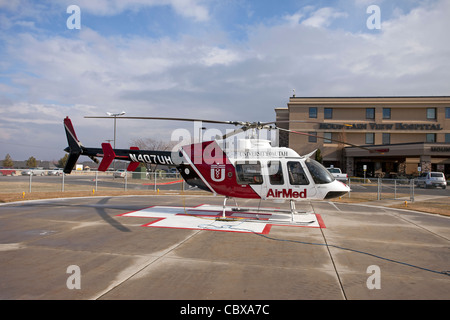 Helicopter AirMed from University of Utah Medical Center ready for emergency flight in front of hospital. Stock Photo