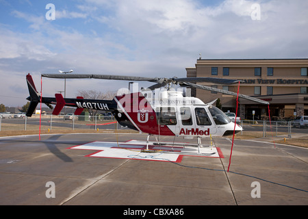 Helicopter AirMed side from University of Utah Medical Center pilot getting ready for emergency flight in front of hospital. Stock Photo