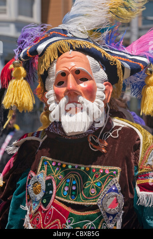 Masked participant at annual Carnaval festival in Mission District, San Francisco, California, USA Stock Photo