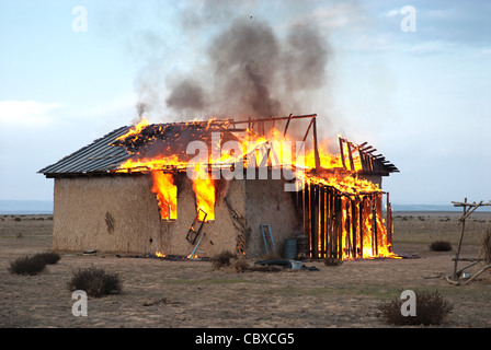Fire in an abandoned house the poor Stock Photo