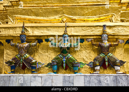 Giant stand around pagoda at wat prakeaw, Thailand Stock Photo