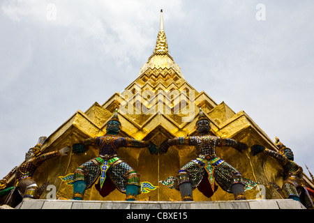 Giant stand around pagoda at wat prakeaw, Thailand Stock Photo