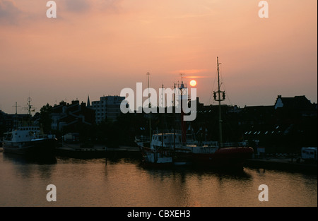 Sunset over the port of East Frisian holiday and marine centre Wilhelmshaven on the North Sea coast of Lower Saxony, Germany Stock Photo