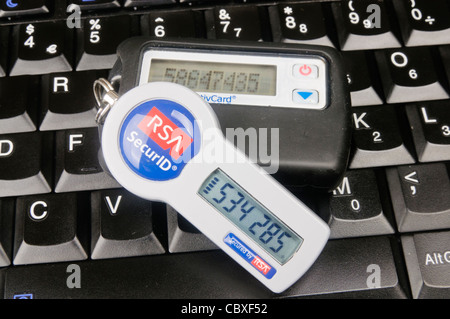 Two SecureID Tokens sitting on a computer keyboard Stock Photo