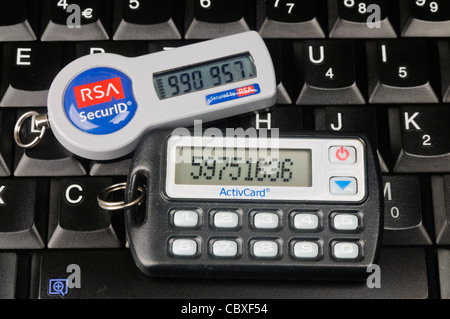 Two SecureID Tokens sitting on a computer keyboard Stock Photo