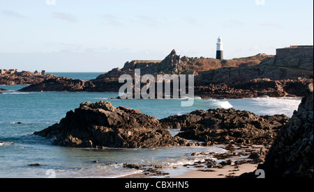 Corblets Bay and Fort Corblets, Alderney, Channel Islands (Quesnard Lighthouse on right) Stock Photo