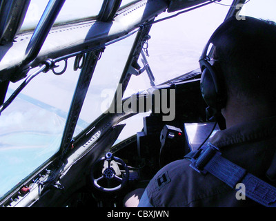 A deployed crew from the 911th Airlift Wing flies over an area near the Persian Gulf from an air base in Southwest Asia to support the ground battle in Marjah, Afghanistan, March 1, 2010. The C-130 Hercules has a Pittsburgh Pirate painted on the nose to show the wing's pride in their hometown of Pittsburgh. Stock Photo