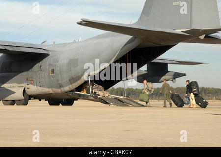 Airmen load onto an MC-130H Combat Talon II before departing for Haiti Jan. 13, 2010 at Hurlburt Field, Fla. These Airmen will participate in the humanitarian assistance and disaster relief mission in Haiti. The Airmen are assigned to the Air Force Special Operations Command. Stock Photo