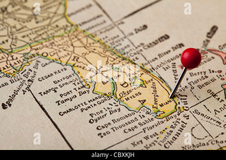 Florida vintage 1920s map (printed in 1926 - copyrights expired) with a red pushpin on Miami, selective focus Stock Photo