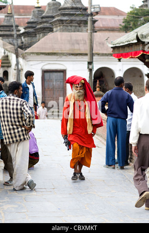 An unidentified Sadhu Holy Man walking in Kathmandu, Nepa Stock Photo