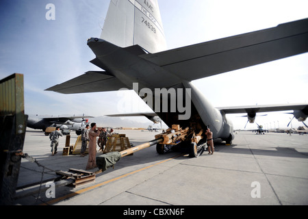 Aircrew load an M777 A2 Howitzer onto a U.S. Air Force C-130J Stock ...