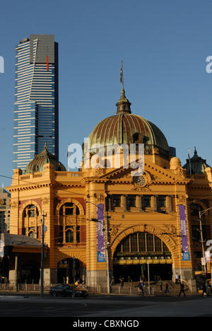 Known landmarks: modern Eureka Tower and historic Flinders Street Station in the centre of Melbourne, Victoria Stock Photo