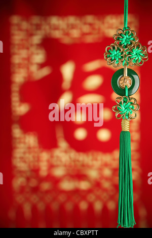 Chinese new year decoration--Closeup of Chinese Knot on festive background. Stock Photo