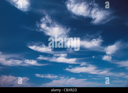 Blue sky with delicate white cirrus clouds. Stock Photo
