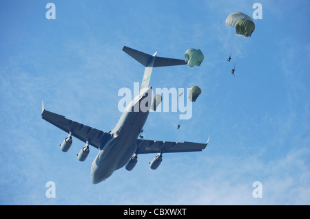 U.S. Army Rangers parachute from a C-17 Globemaster III aircraft over Fort Benning, Ga., Aug. 3 during Ranger Rendezvous 2009. More than 1,000 Rangers assigned to four Ranger battalions from across the country participated in the mass tactical jump. Stock Photo