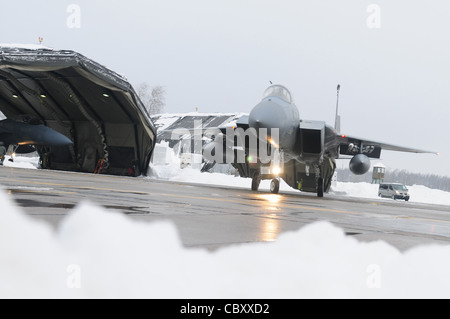 An F-15C Eagle from the 493rd Expeditionary Fighter Squadron taxis before flying to its home station of Royal Air Force Lakenheath, England, upon finishing a rotation of NATO's Baltic air policing mission. The 493rd EFS assumed command of the mission from the Polish Sept. 1, 2010 and relinquished it to the German air force Jan. 5, 2011. Stock Photo