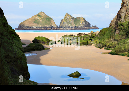 The beach at Hollywell Bay in Cornwall captured at low tide Stock Photo