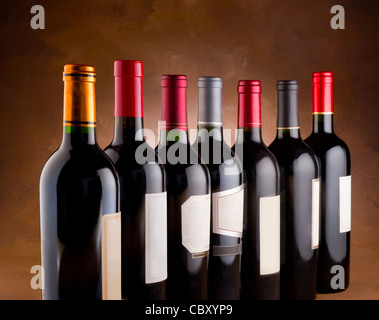 Red wine bottles in a row Stock Photo