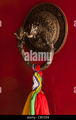 India, Bihar, Bodhgaya, Buddhism, Tibetan Temple, bronze dragon door knocker Stock Photo