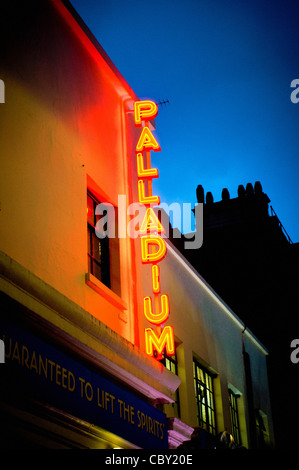 Red and yellow neon sign outside Palladium theatre, London. Stock Photo