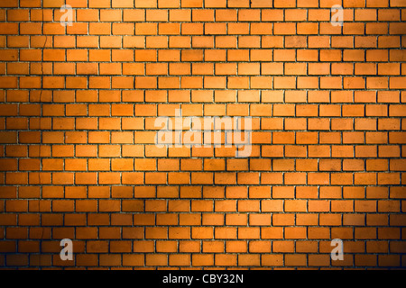 orange brick wall background with natural shadow vignette Stock Photo