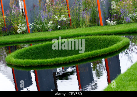 Garden Display at the Hampton Court Flower Show: 'The World Vision Garden' Stock Photo