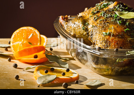 Chicken roasted with herbs serve with orange fruit Stock Photo