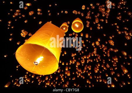 Traditional fire lanterns being released into the night sky during the Loi Krathongfestival in Chiang Mai, Thailand, Asia. Stock Photo
