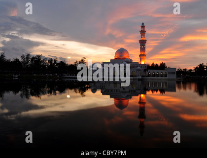 Masjid Tengku Tengah Zaharah or also known as Floating Mosque in Kuala Terengganu, Malaysia with reflection. Stock Photo