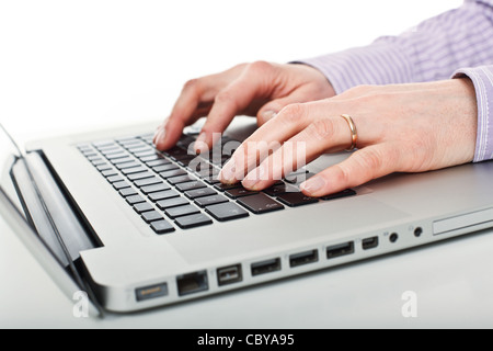 detail on laptop and worker hands Stock Photo