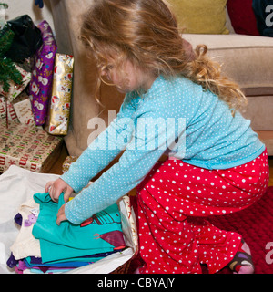 3 Year Old Child Girl Infant Toddler Opening A Xmas Christmas Present presents Gift Stock Photo