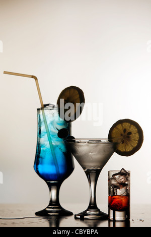 Three cocktails in a row against a light background Stock Photo