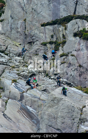 Climbers at Cwm Idwal on the slabs Ogwen north Wales Uk Stock Photo