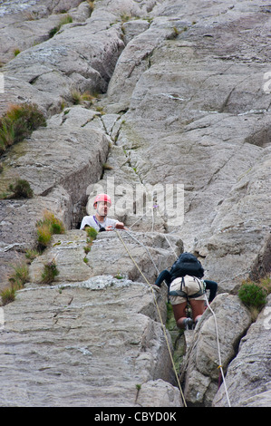 Climbers at Cwm Idwal on the slabs Ogwen north Wales Uk Stock Photo