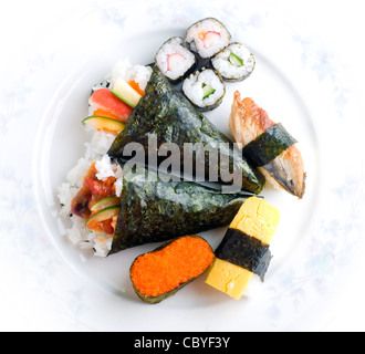 Close-up of a lot of sushi rolls with different fillings lie on a ...