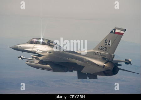 An instructor pilot with the Texas Air National GuardÕs 149th Fighter Wing returns to base after completing an Exercise Coronet Cactus training mission April 24, near Tucson, Arizona. The 149th Fighter Wing trains active duty F-16 pilots prior to assignment to their first duty station. Coronet Cactus is a Òfinal examÓ of sorts and provides student pilots an opportunity to apply everything they have learned during seven-and-a-half months of training. Stock Photo